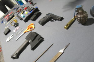 GRENADE & AXE AMONG ITEMS FOUND BY QCIA TSA