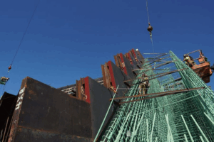 WORKERS ALLEGE LUNDA DELAYING I74 BRIDGE