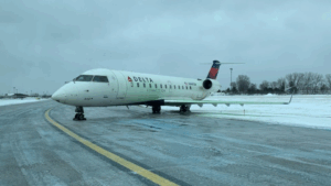 WINTERY WEATHER REQUIRES TAXIWAY PASSENGER TRANSFER OFF DELTA PLANE AT QCIA