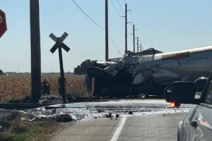 HOLY LIQUID ASPHALT! TRAIN CUTS SEMI IN HALF!