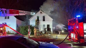 Moline firefighters battle house fire on 4th St early 01/08