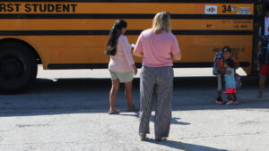 Bad weather kept these Urbana children out of school. New bus-stop shelter is in the works